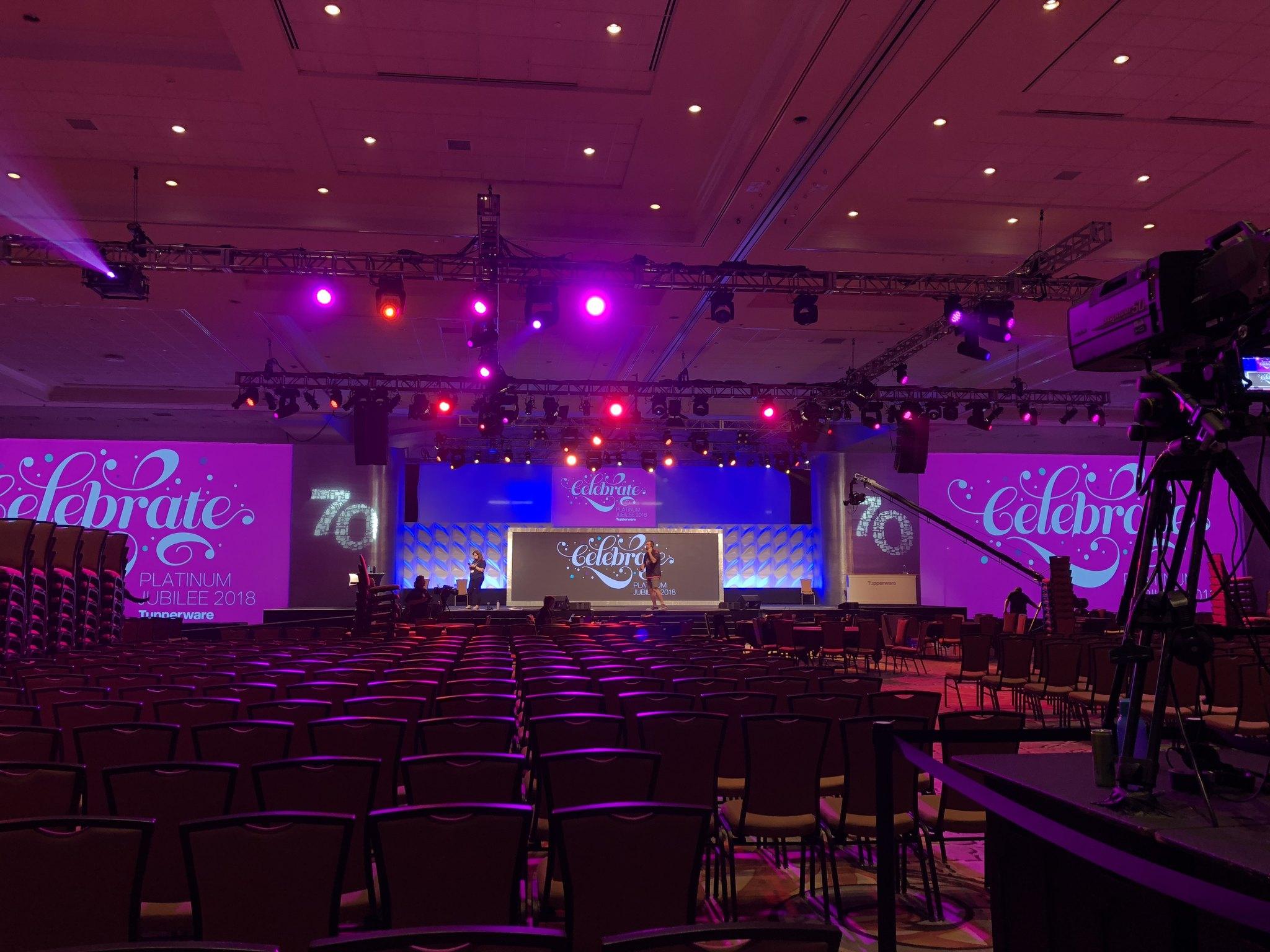 Moving-head stage lighting over a live event