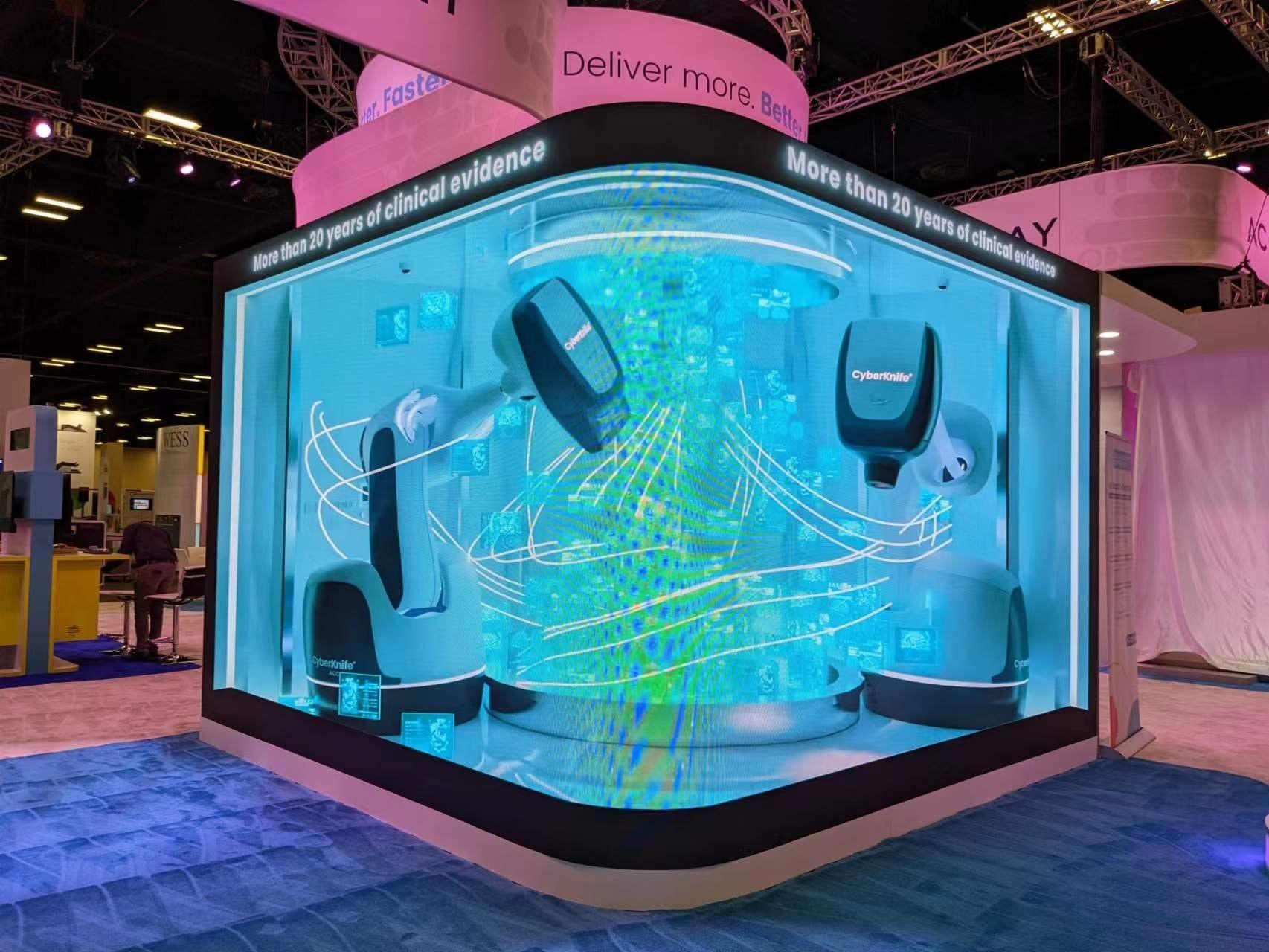 Curved P2.3 LED video wall playing 3D content on a trade show booth