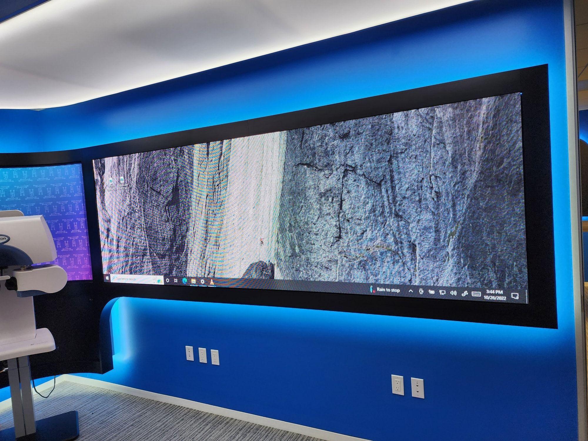 Ground-supported LED video wall standing on a trade show floor