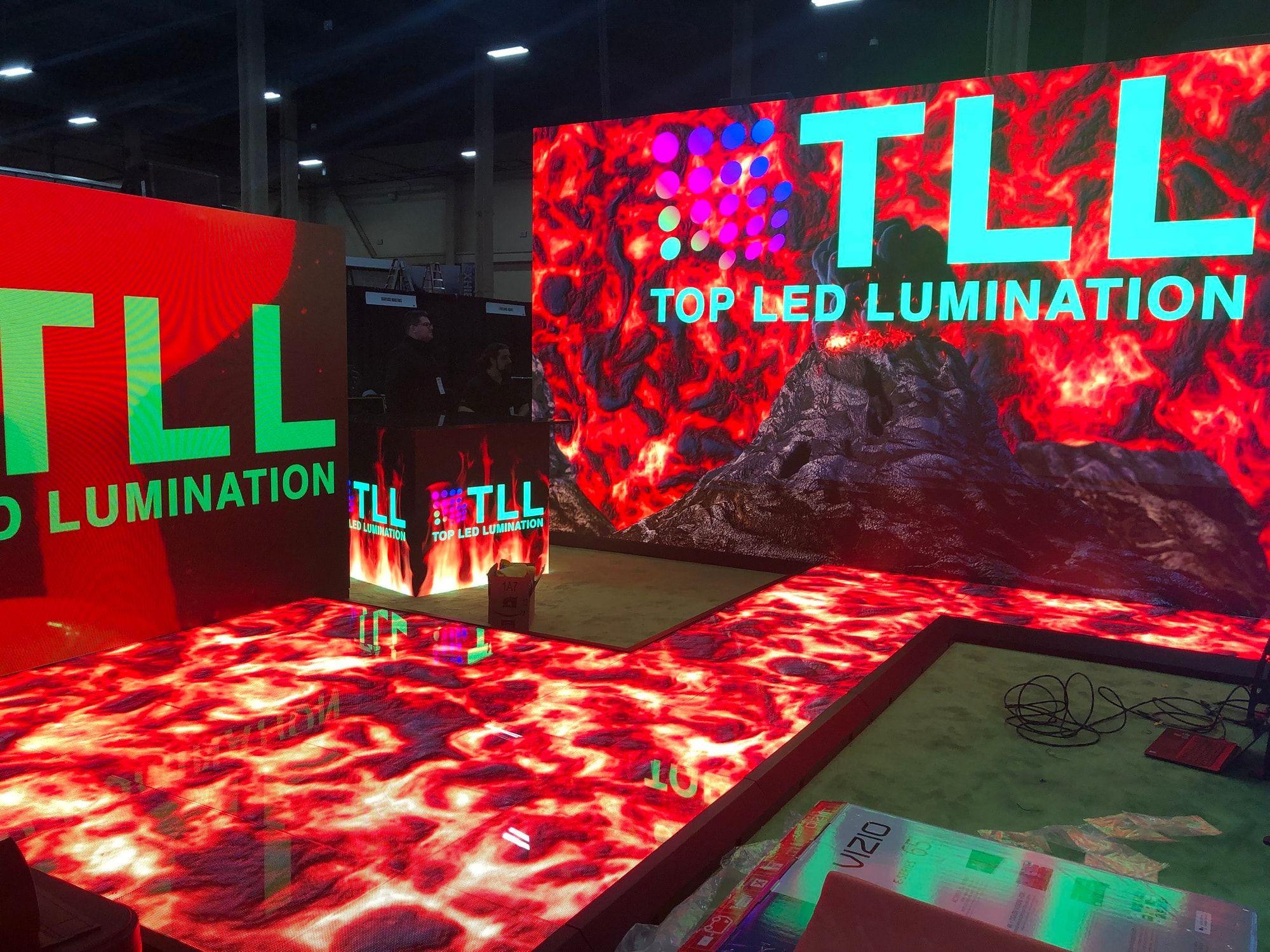 Floor-mounted LED video wall playing branded content at a show