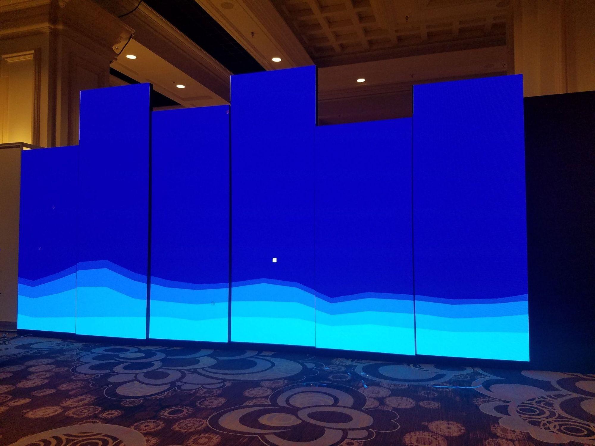 Ground-supported LED wall backdrop in an exhibit booth
