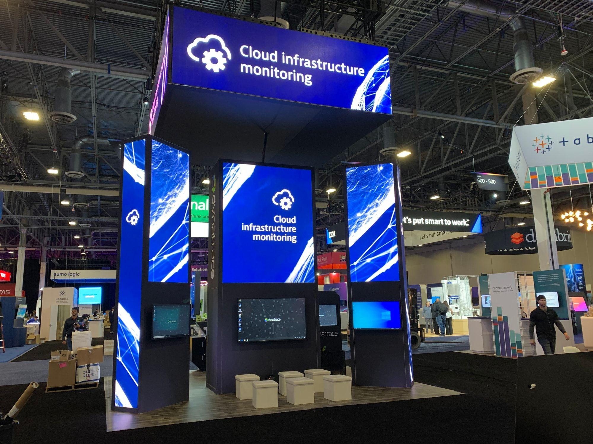 Freestanding LED columns and header wall on a tech booth