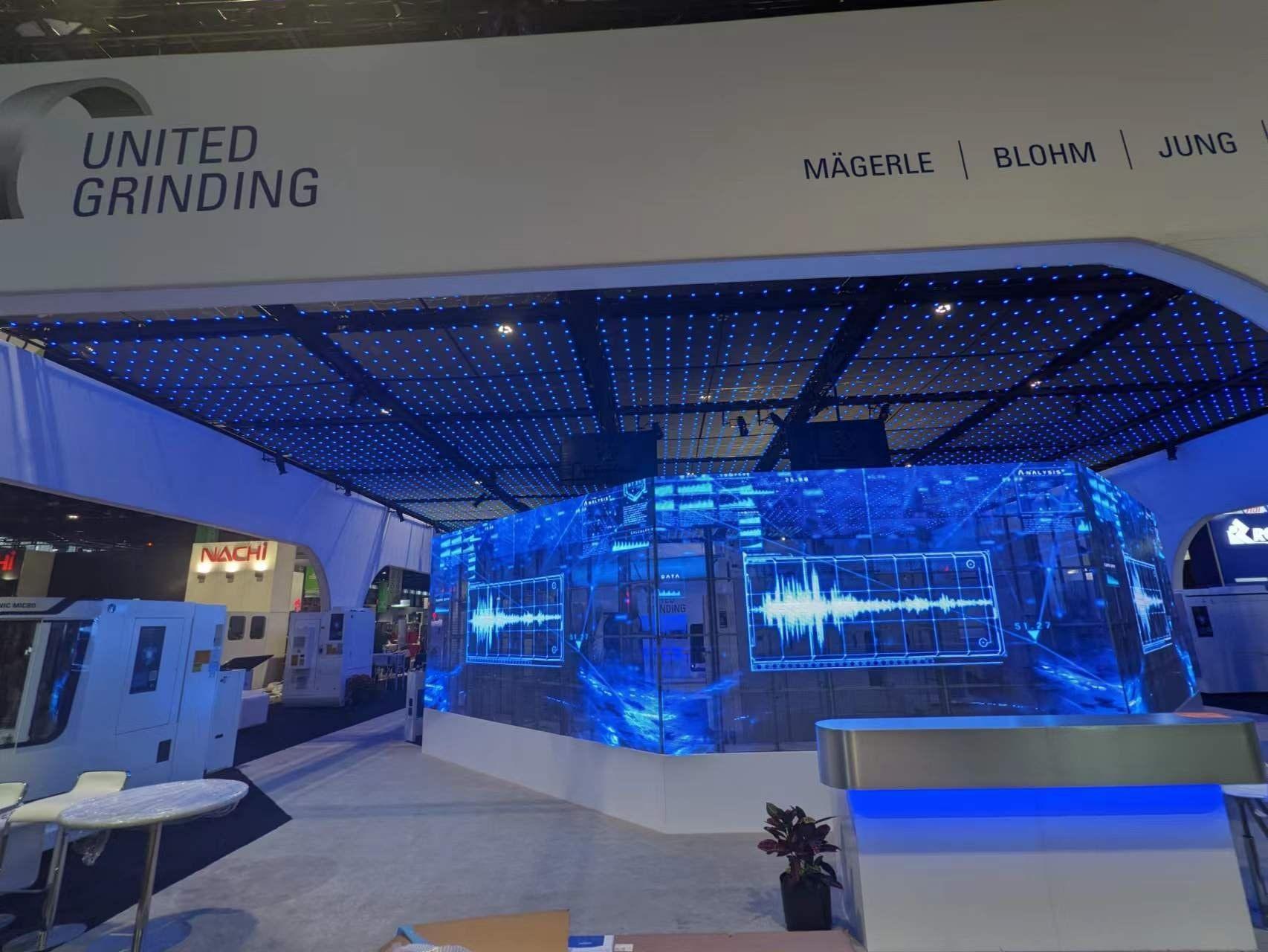 See-through LED video wall letting a booth interior show through the screen
