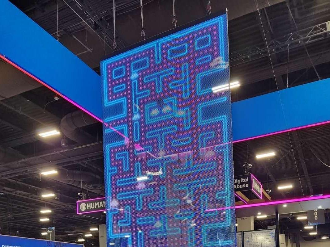 See-through mesh LED screen suspended as a transparent booth feature